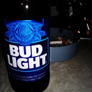 a bottle of bud light on a table