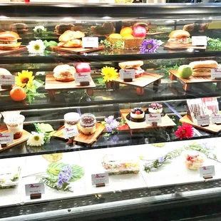 a display of sandwiches and pastries