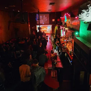 a crowd of people at a bar
