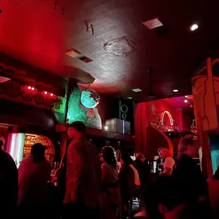 a crowd of people in a bar