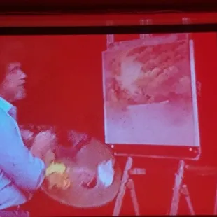 You can go wrong with Bob Ross episodes projected on the wall.