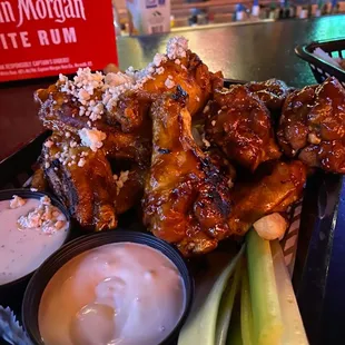a plate of chicken wings and celery