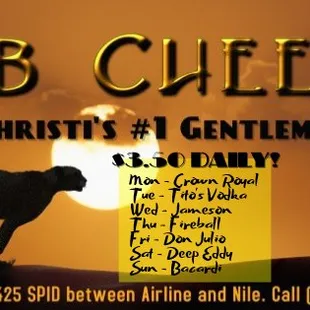 a silhouette of a cow on a hill