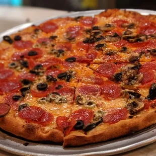 Pepperoni pizza with mushrooms and olives