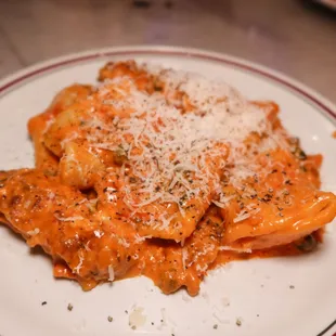 a plate of ravioli with cheese and parmesan