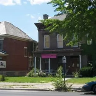 a row of houses on a street corner