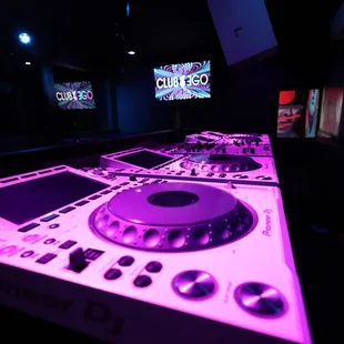 a dj's deck in a dimly lit room