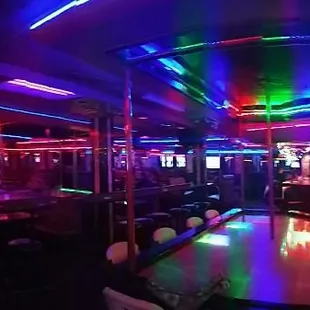 3 stages, poles and 1 stripper who can turn upside down and fuck the damn ceiling!