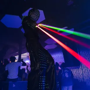 a man dressed in a costume with laser lights on his head