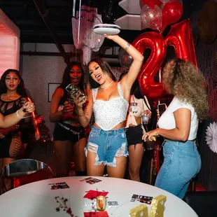 a group of women dancing at a party