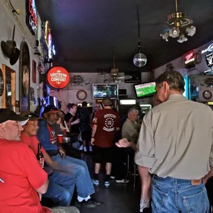 a group of people sitting at a bar