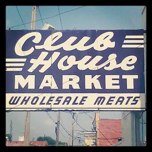 a sign for club house market
