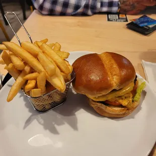 a burger and fries on a plate