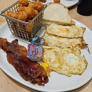 Eggs overhard, bacon, white toast