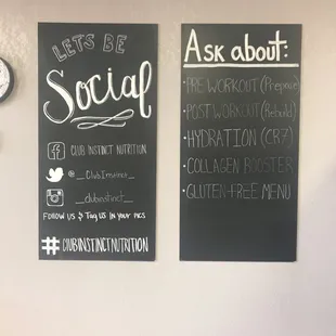 a wall with a chalkboard and a clock