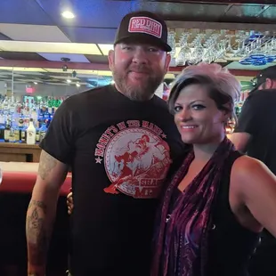 a man and a woman posing for a picture