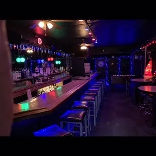 a photo of a bar with neon lights