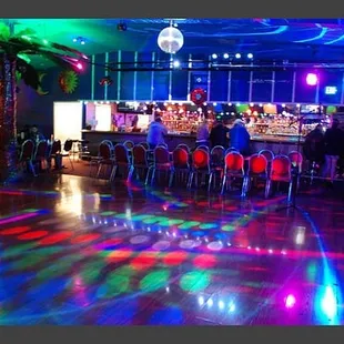 a brightly lit dance floor