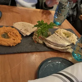 a plate of hummus and pita bread