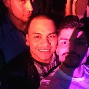 a man taking a selfie with friends