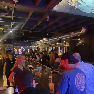 a crowd of people at a bar