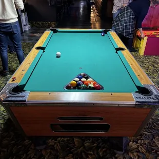 a pool table in a bar