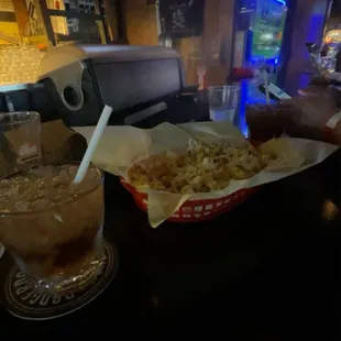 Jack and Coke next to the popcorn