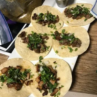 four tortillas on a cutting board