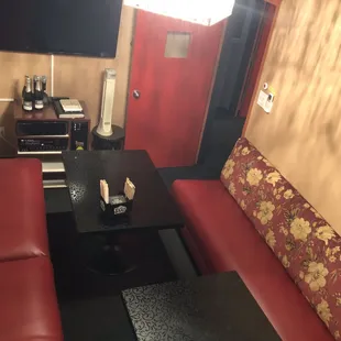 a red couch and a black coffee table