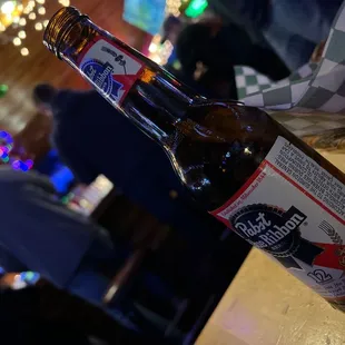 a bottle of beer on a table