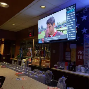 a bar with a large screen tv