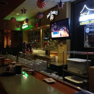 a bar with a large screen tv