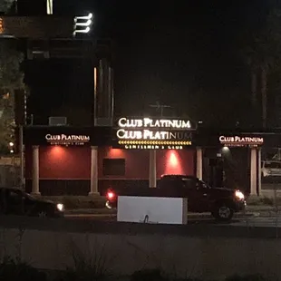 the outside of a club platinum restaurant at night