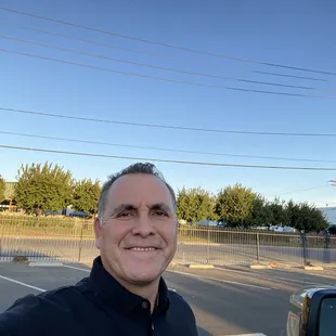 a man standing in a parking lot