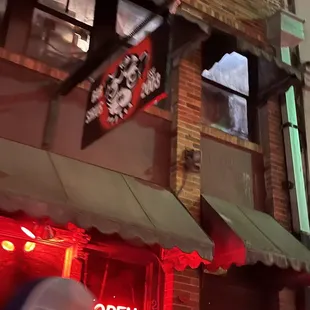 a man walking in front of a bar