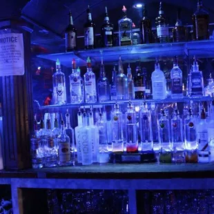 a bar with bottles of alcohol