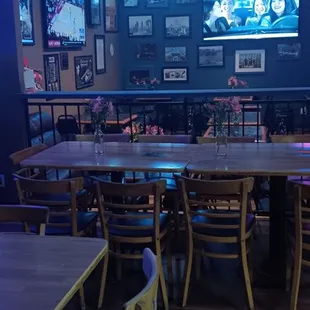 tables, chairs, and neon signs
