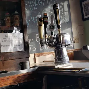 a bar with beer taps