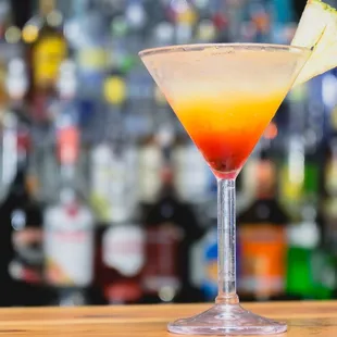 a cocktail with a pineapple garnish