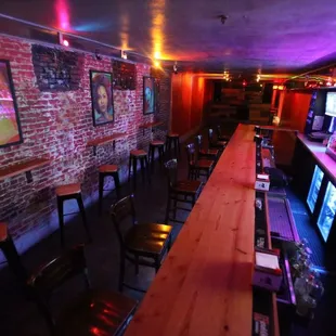 a bar with wooden tables and chairs