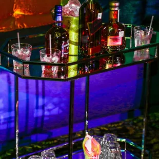 a bar cart filled with drinks