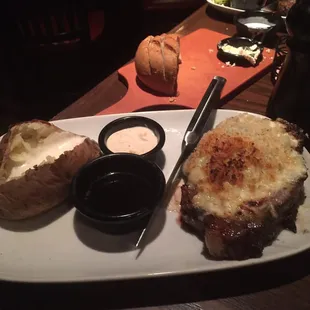 a plate of food with bread and dipping sauce