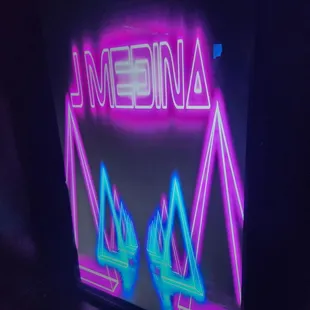 a neon sign that reads media