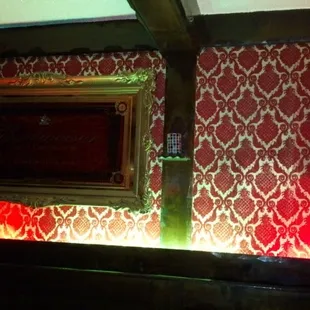 a picture of a bar with red lighting