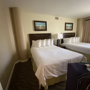 Second room with two queen beds and an adjacent balcony as well