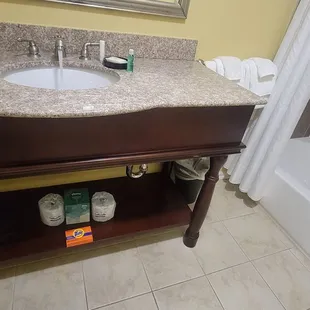 Sink and Mirror area, equipped with soap tissue, laundry soap hair dryer and make up mirrors