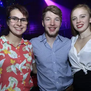 three people posing for a picture