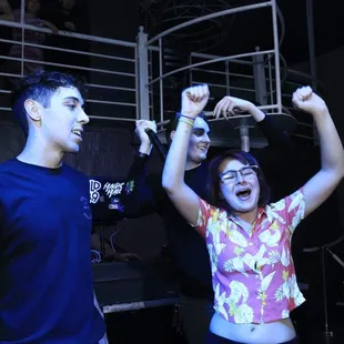 a man and a woman dancing in front of a crowd