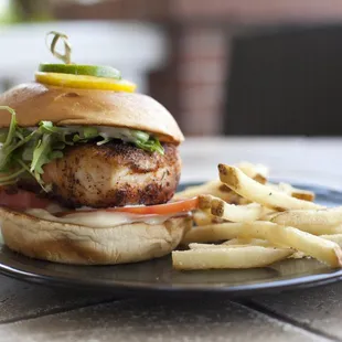 a grilled chicken sandwich and french fries