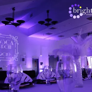 Clubhouse Woodcreek set up for a Great Gatsby theme prom with Purple Uplighting +  Custom Monogram